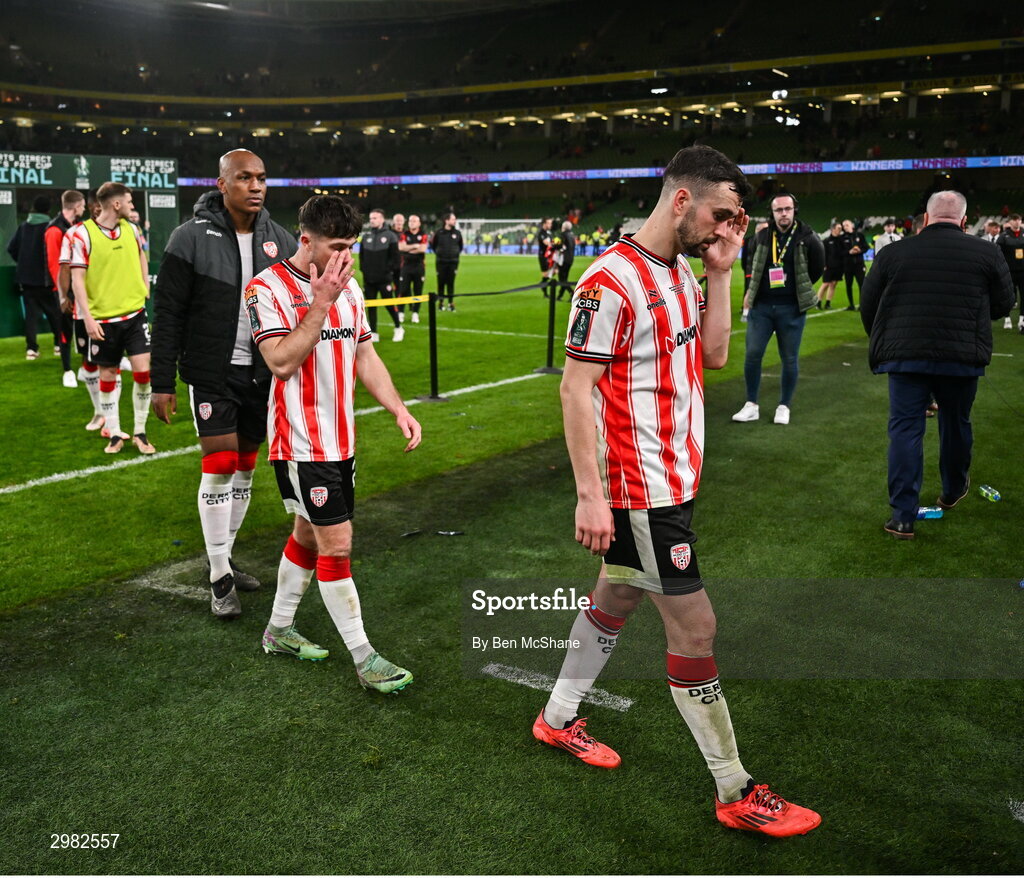 10 November 2024; Derry City players, including Michael Duffy, leave the pitch after the Sports Direct Men's FAI Cup Final match between Drogheda United and Derry City at the Aviva Stadium in Dublin. Photo by Ben McShane/Sportsfile