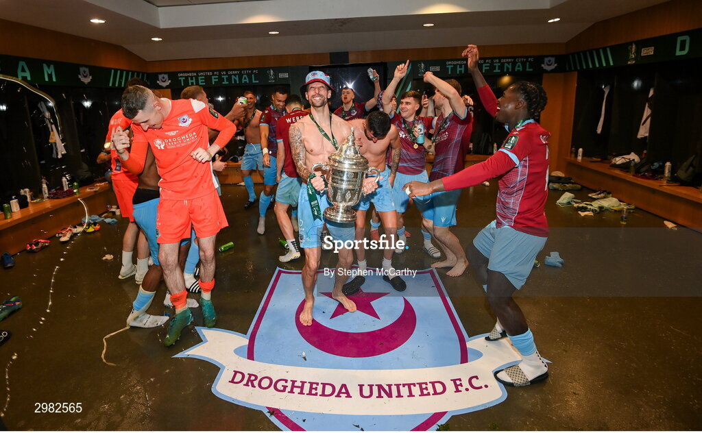 10 November 2024; Adam Foley of Drogheda United and teammates celebrate with the FAI cup in the dressingroom after the Sports Direct Men's FAI Cup Final match between Drogheda United and Derry City at the Aviva Stadium in Dublin. Photo by Stephen McCarthy/Sportsfile