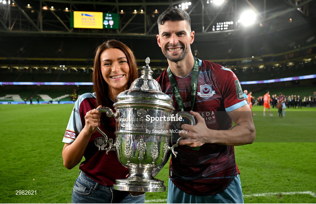 10 November 2024; Adam Foley of Drogheda United celebrates with his wife Nadine and the FAI cup after the Sports Direct Men's FAI Cup Final match between Drogheda United and Derry City at the Aviva Stadium in Dublin. Photo by Stephen McCarthy/Sportsfile