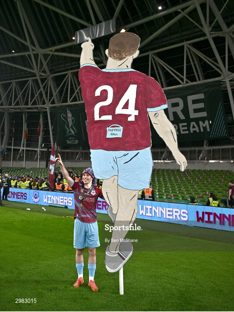 10 November 2024; Warren Davis of Drogheda United celebrates with a 'tifo' depicting himself after the Sports Direct Men's FAI Cup Final match between Drogheda United and Derry City at the Aviva Stadium in Dublin. Photo by Ben McShane/Sportsfile