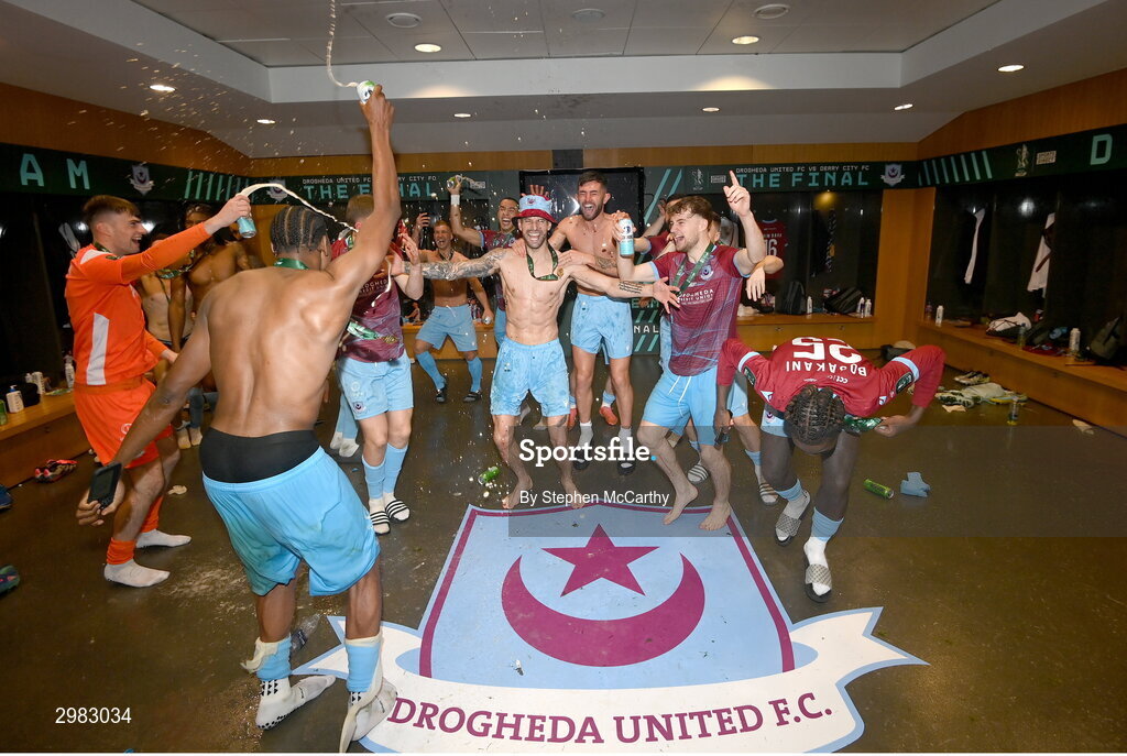 10 November 2024; Drogheda United players celebrate in the dressing room after the Sports Direct Men's FAI Cup Final match between Drogheda United and Derry City at the Aviva Stadium in Dublin. Photo by Stephen McCarthy/Sportsfile