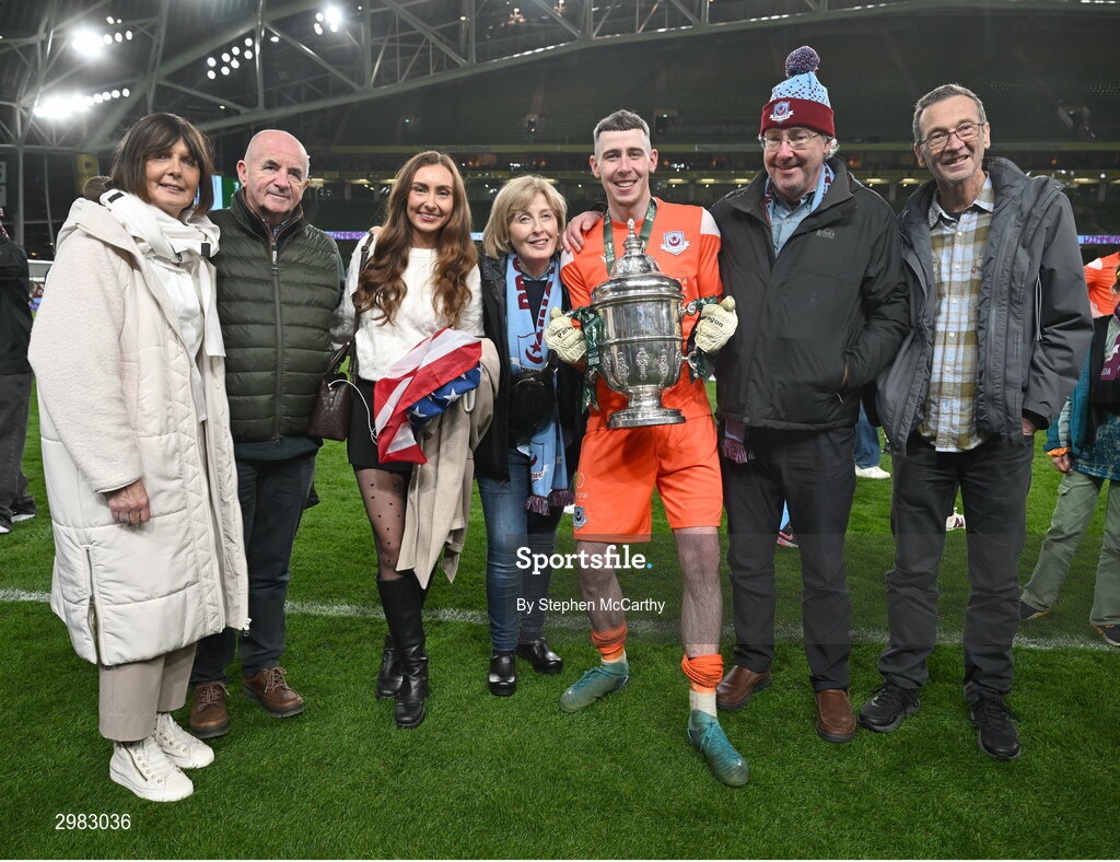 10 November 2024; Drogheda United goalkeeper Luke Dennison celebrates with the FAI Cup and family after the Sports Direct Men's FAI Cup Final match between Drogheda United and Derry City at the Aviva Stadium in Dublin. Photo by Stephen McCarthy/Sportsfile