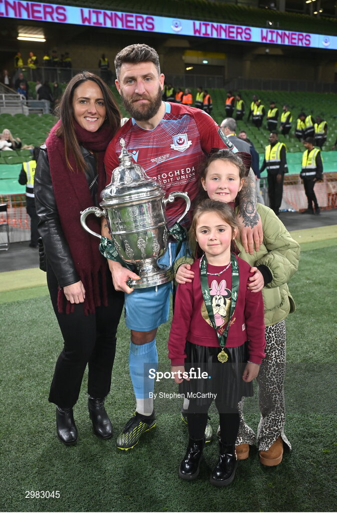 10 November 2024; Gary Deegan of Drogheda United celebrates with the FAI Cup and family after the Sports Direct Men's FAI Cup Final match between Drogheda United and Derry City at the Aviva Stadium in Dublin. Photo by Stephen McCarthy/Sportsfile