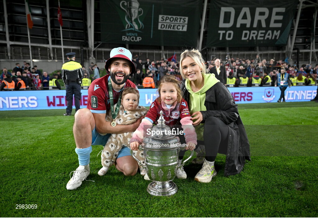 10 November 2024; Dave Webster of Drogheda United celebrates with the FAI Cup and family Aria, Charlie and fiancée, Olya after the Sports Direct Men's FAI Cup Final match between Drogheda United and Derry City at the Aviva Stadium in Dublin. Photo by Stephen McCarthy/Sportsfile