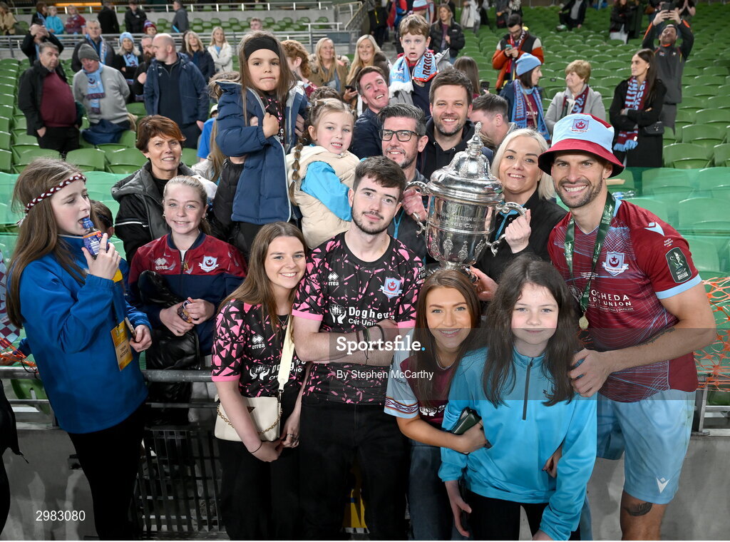 10 November 2024; Adam Foley of Drogheda United celebrates with the FAI Cup and family after the Sports Direct Men's FAI Cup Final match between Drogheda United and Derry City at the Aviva Stadium in Dublin. Photo by Stephen McCarthy/Sportsfile