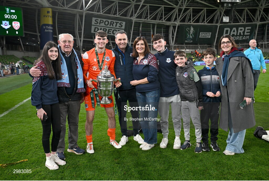 10 November 2024; Drogheda United goalkeeper Andrew Wogan celebrates with the FAI Cup and family after the Sports Direct Men's FAI Cup Final match between Drogheda United and Derry City at the Aviva Stadium in Dublin. Photo by Stephen McCarthy/Sportsfile