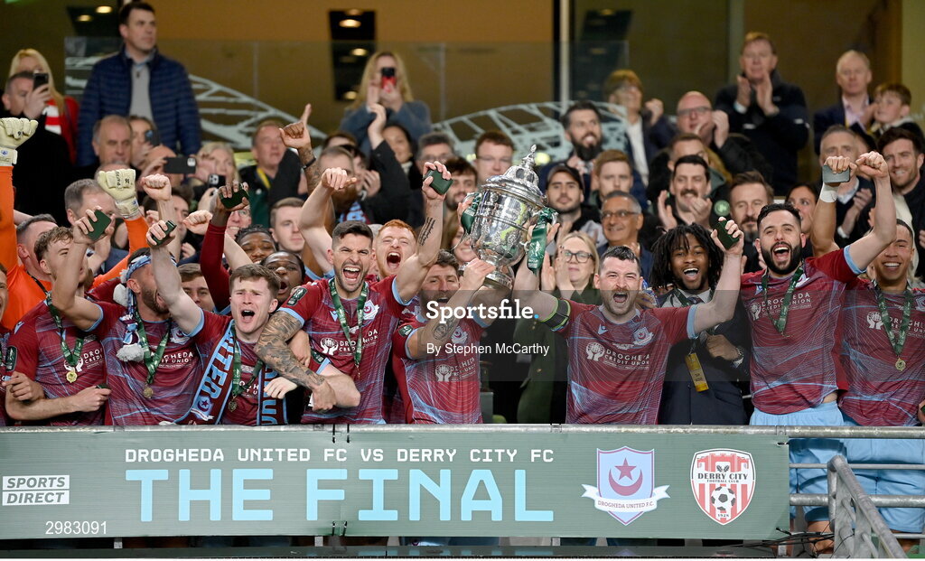 10 November 2024; Drogheda United's Gary Deegan and Ryan Brennan lift the FAI Cup after the Sports Direct Men's FAI Cup Final match between Drogheda United and Derry City at the Aviva Stadium in Dublin. Photo by Stephen McCarthy/Sportsfile