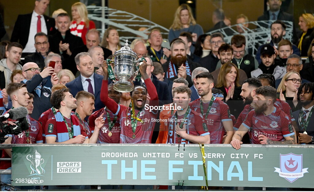 10 November 2024; Bridel Bosakani of Drogheda United lifts the FAI Cup after the Sports Direct Men's FAI Cup Final match between Drogheda United and Derry City at the Aviva Stadium in Dublin. Photo by Stephen McCarthy/Sportsfile