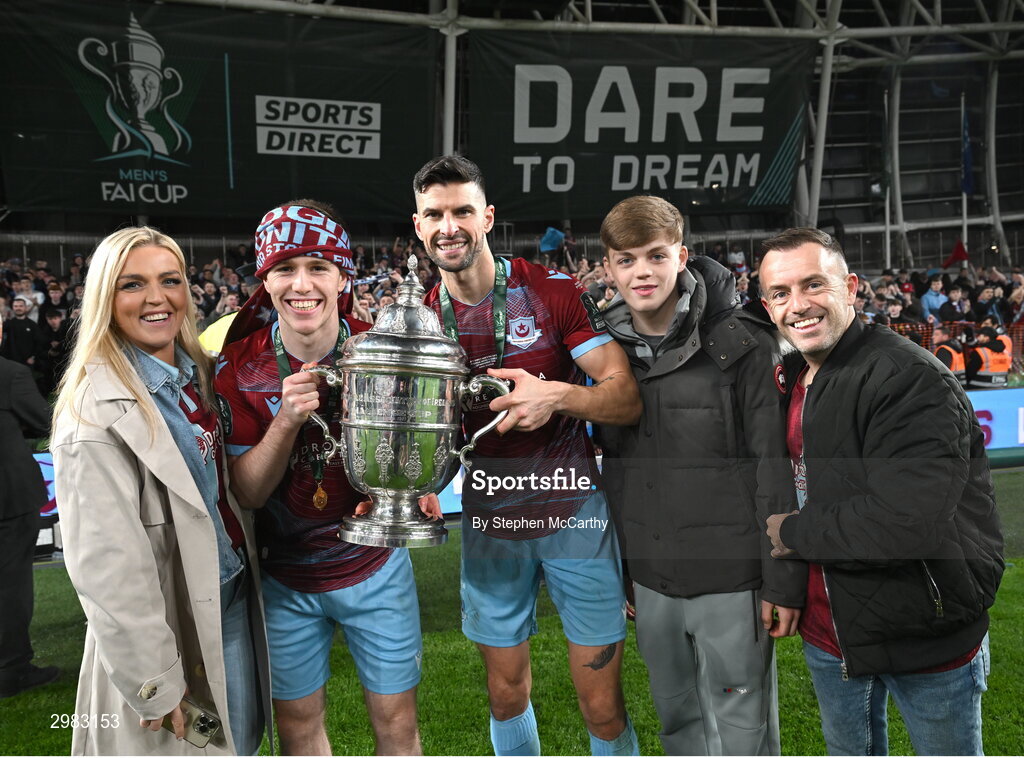 10 November 2024; Warren Davis and Adam Foley of Drogheda United celebrate with the FAI Cup and family after the Sports Direct Men's FAI Cup Final match between Drogheda United and Derry City at the Aviva Stadium in Dublin. Photo by Stephen McCarthy/Sportsfile