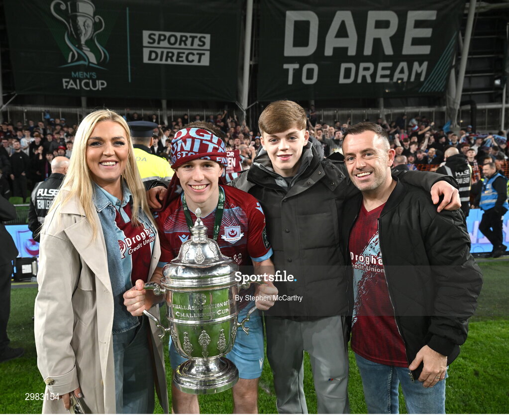 10 November 2024; Warren Davis of Drogheda United celebrates with the FAI Cup and family after the Sports Direct Men's FAI Cup Final match between Drogheda United and Derry City at the Aviva Stadium in Dublin. Photo by Stephen McCarthy/Sportsfile