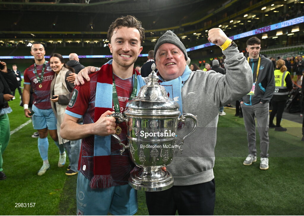 10 November 2024; Darragh Markey of Drogheda United celebrates with the FAI Cup and his father after the Sports Direct Men's FAI Cup Final match between Drogheda United and Derry City at the Aviva Stadium in Dublin. Photo by Stephen McCarthy/Sportsfile