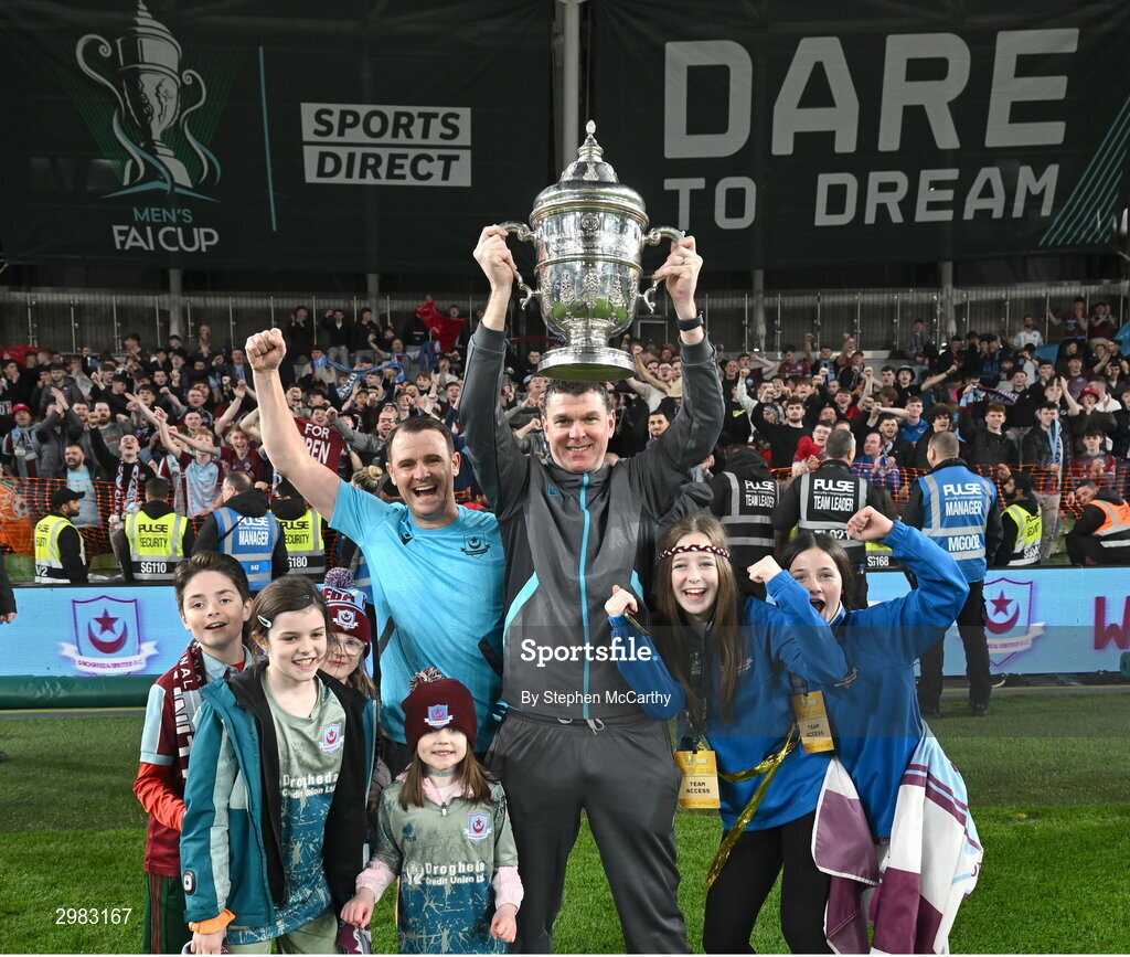 10 November 2024; Drogheda United manager Kevin Doherty and assistant manager Daire Doyle celebrate with the FAI Cup and family after the Sports Direct Men's FAI Cup Final match between Drogheda United and Derry City at the Aviva Stadium in Dublin. Photo by Stephen McCarthy/Sportsfile