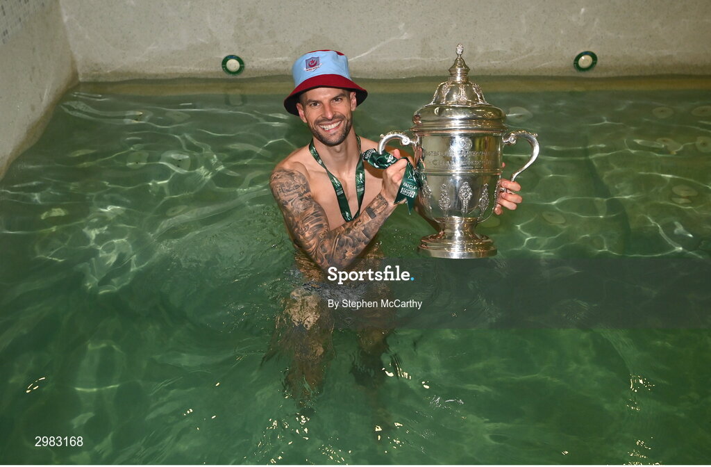 10 November 2024; Adam Foley of Drogheda United celebrates with the FAI Cup in their dressing room after the Sports Direct Men's FAI Cup Final match between Drogheda United and Derry City at the Aviva Stadium in Dublin. Photo by Stephen McCarthy/Sportsfile
