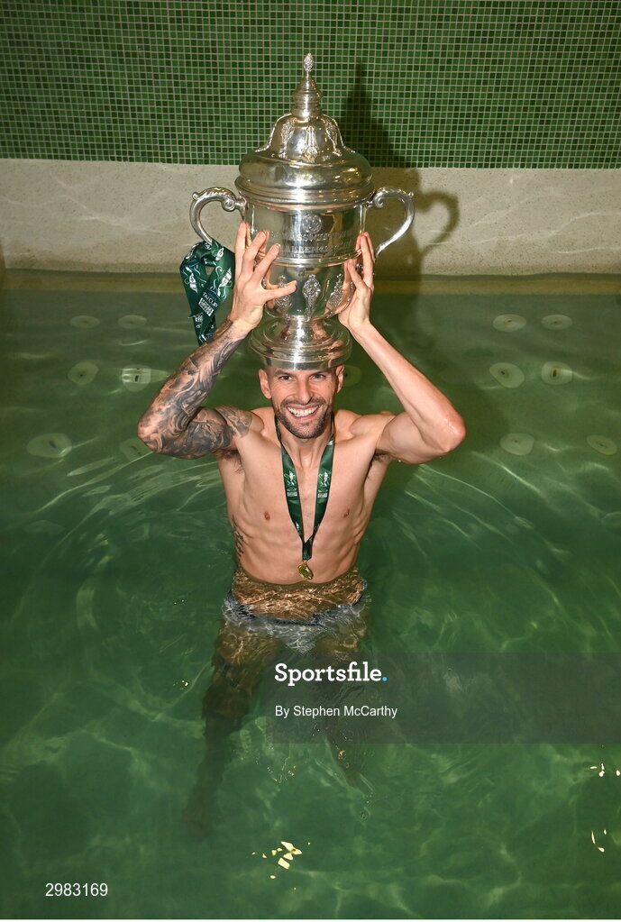 10 November 2024; Adam Foley of Drogheda United celebrates with the FAI Cup in their dressing room after the Sports Direct Men's FAI Cup Final match between Drogheda United and Derry City at the Aviva Stadium in Dublin. Photo by Stephen McCarthy/Sportsfile