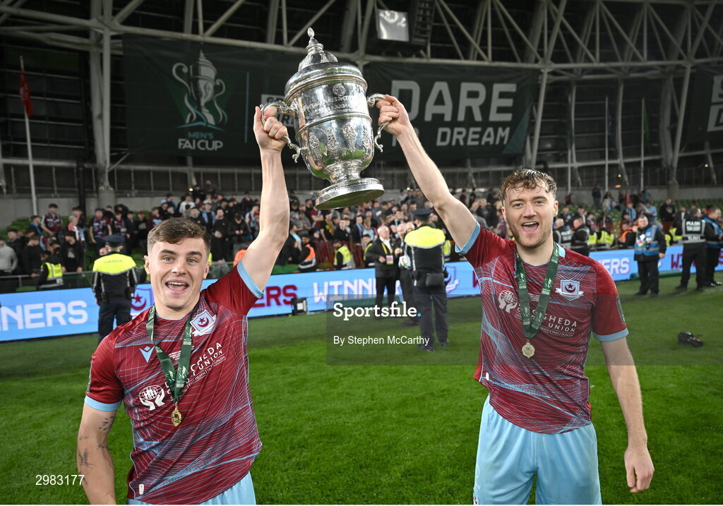 10 November 2024; Drogheda United's Aaron McNally, left, and Andrew Quinn celebrate with the FAI Cup after the Sports Direct Men's FAI Cup Final match between Drogheda United and Derry City at the Aviva Stadium in Dublin. Photo by Stephen McCarthy/Sportsfile