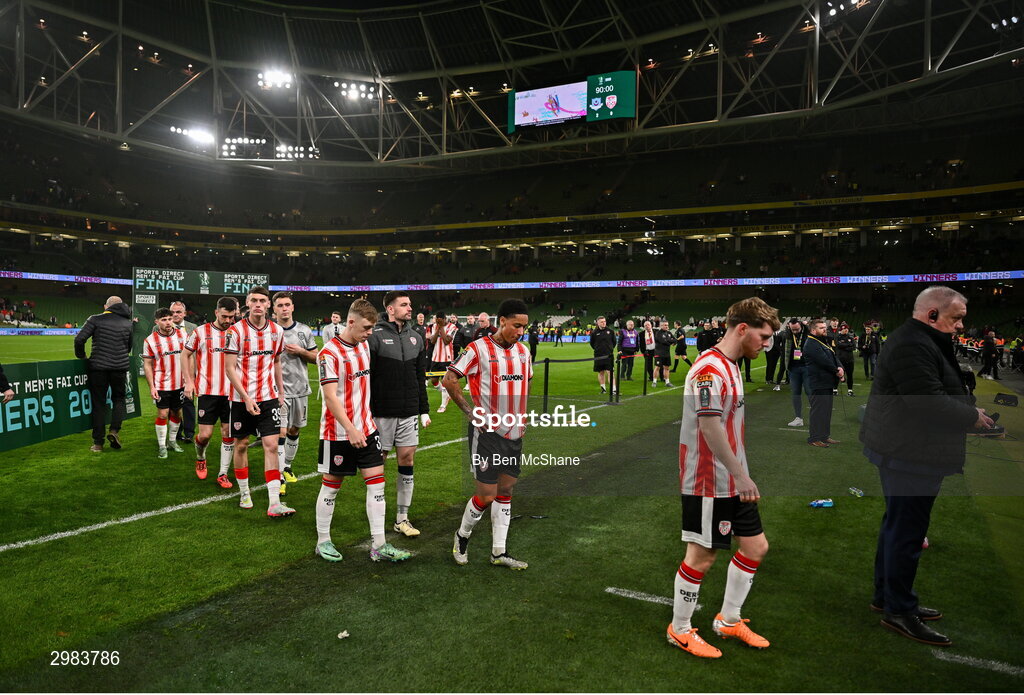 10 November 2024; Derry City players make their way to collect their runners-up medals after their defeat in the Sports Direct Men's FAI Cup Final match between Drogheda United and Derry City at the Aviva Stadium in Dublin. Photo by Ben McShane/Sportsfile