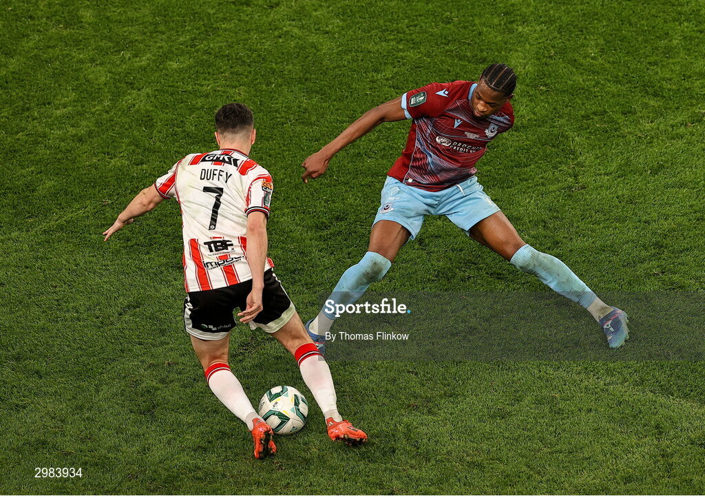 10 November 2024; Elicha Ahui of Drogheda United in action against Michael Duffy of Derry City during the Sports Direct Men's FAI Cup Final match between Drogheda United and Derry City at the Aviva Stadium in Dublin. Photo by Thomas Flinkow/Sportsfile