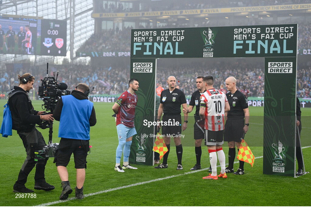 10 November 2024; Referee Rob Harvey and his officals assistant referee Emmett Dynan, left, and assistant referee Allen Lynch, right, conduct the coin toss with captains Ryan Brennan of Drogheda United and Patrick McEleney of Derry City before the Sports Direct Men's FAI Cup Final match between Drogheda United and Derry City at the Aviva Stadium in Dublin. Photo by Stephen McCarthy/Sportsfile