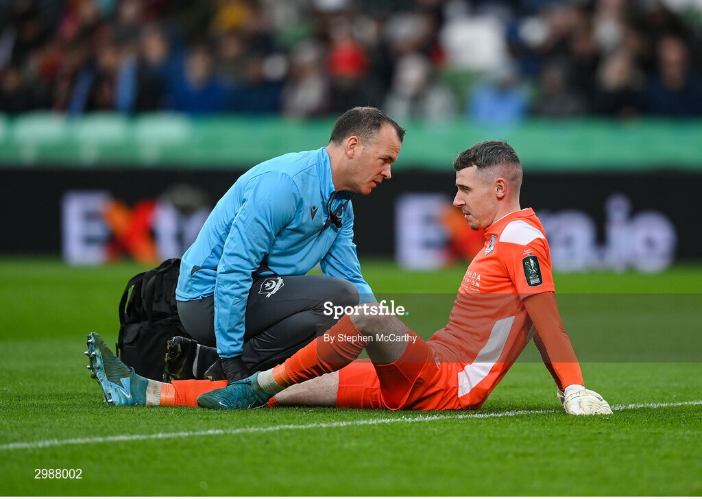 10 November 2024; Drogheda United physiotherapist Keith Browne attends to goalkeeper Luke Dennison during the Sports Direct Men's FAI Cup Final match between Drogheda United and Derry City at the Aviva Stadium in Dublin. Photo by Stephen McCarthy/Sportsfile