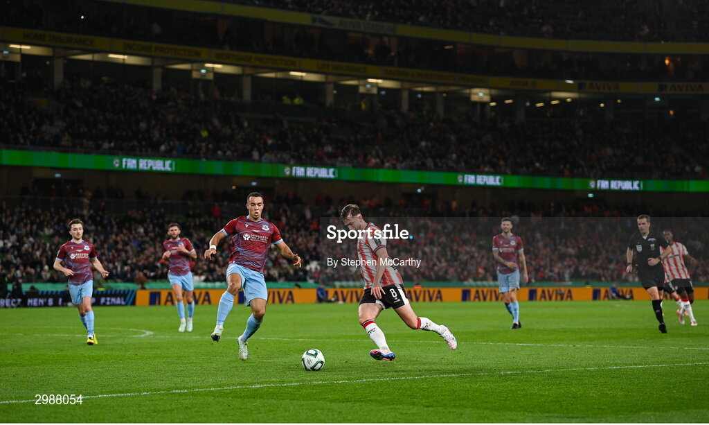 10 November 2024; Will Patching of Derry City in action against Douglas James-Taylor of Drogheda United during the Sports Direct Men's FAI Cup Final match between Drogheda United and Derry City at the Aviva Stadium in Dublin. Photo by Stephen McCarthy/Sportsfile