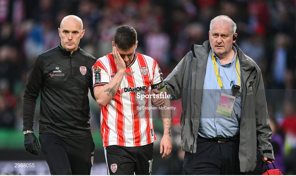 10 November 2024; Patrick McEleney of Derry City is assisted from the pitch by team doctor Neil McKeon and stadium doctor Mick Molloy during the Sports Direct Men's FAI Cup Final match between Drogheda United and Derry City at the Aviva Stadium in Dublin. Photo by Stephen McCarthy/Sportsfile