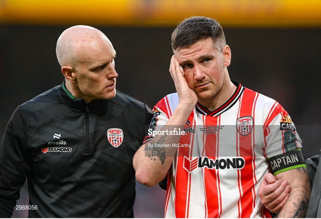 10 November 2024; Patrick McEleney of Derry City is assisted from the pitch by team doctor Neil McKeon after picking up an injury during the Sports Direct Men's FAI Cup Final match between Drogheda United and Derry City at the Aviva Stadium in Dublin. Photo by Stephen McCarthy/Sportsfile