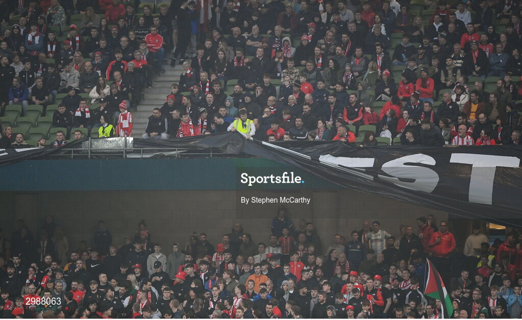 10 November 2024; Satdium stewards remove a banner from the South Stand hung by Derry City supporters during the Sports Direct Men's FAI Cup Final match between Drogheda United and Derry City at the Aviva Stadium in Dublin. Photo by Stephen McCarthy/Sportsfile