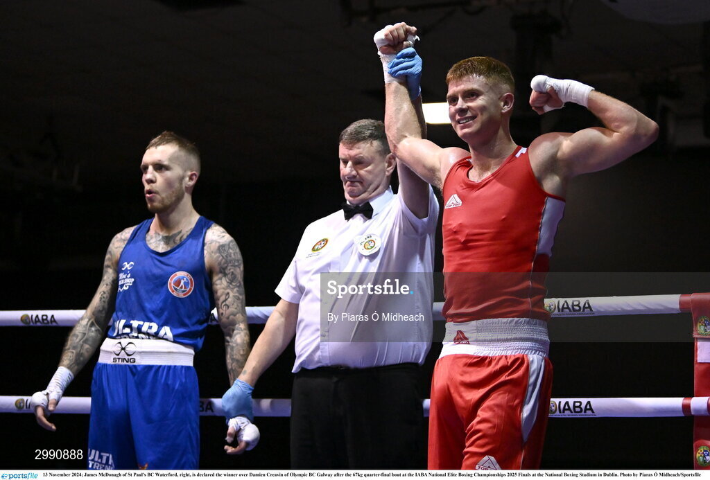 13 November 2024; James McDonagh of St Paul's BC Waterford, right, is declared the winner over Damien Creavin of Olympic BC Galway after the 67kg quarter-final bout at the IABA National Elite Boxing Championships 2025 Finals at the National Boxing Stadium in Dublin. Photo by Piaras Ó Mídheach/Sportsfile