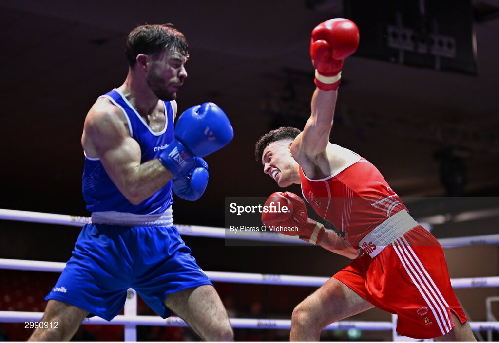 13 November 2024; Eugene McKeever of Holy Family BC Drogheda, Louth, left, in action against Jon McConnell of Holy Trinity BC Belfast during the 71kg semi-final bout at the IABA National Elite Boxing Championships 2025 Finals at the National Boxing Stadium in Dublin. Photo by Piaras Ó Mídheach/Sportsfile