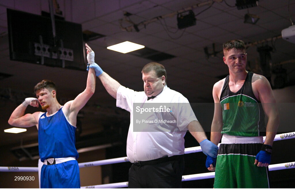 13 November 2024; Taylor Guiney of St Mary’s BC, Dublin, left, is declared the winner over TJ King of Ballyboughal/Defence Forces after the 75kg semi-final bout at the IABA National Elite Boxing Championships 2025 Finals at the National Boxing Stadium in Dublin. Photo by Piaras Ó Mídheach/Sportsfile