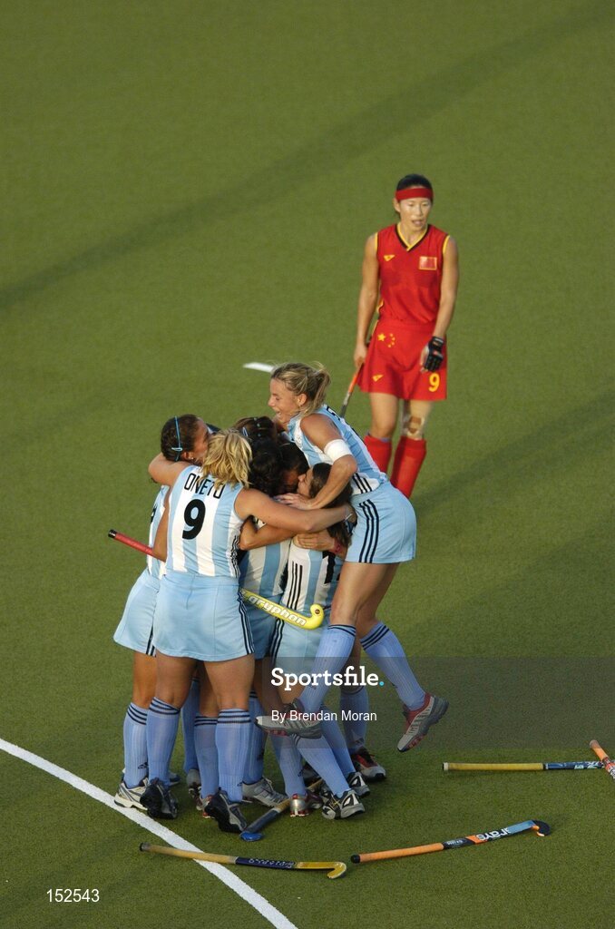26 August 2004; Luciana Aymar, hidden, is congratulated by her Argentinan team-mates after scoring the only goal of the game against China. Bronze Medal Match, Argentina v China, Olympic Hockey Centre, Helliniko Sports Complex. Games of the XXVIII Olympiad, Athens Summer Olympics Games 2004, Athens, Greece. Picture credit; Brendan Moran / SPORTSFILE