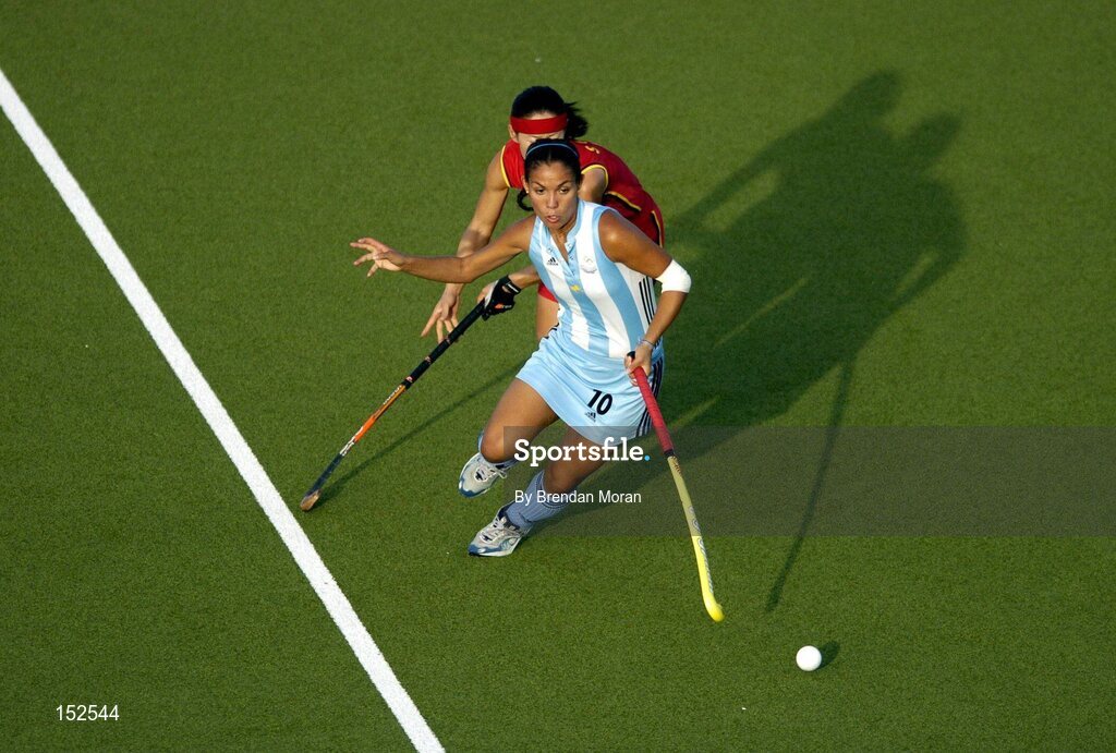 26 August 2004; Agustina Garcia, Argentina, in action against Li Shuang, China. Bronze Medal Match, Argentina v China, Olympic Hockey Centre, Helliniko Sports Complex. Games of the XXVIII Olympiad, Athens Summer Olympics Games 2004, Athens, Greece. Picture credit; Brendan Moran / SPORTSFILE