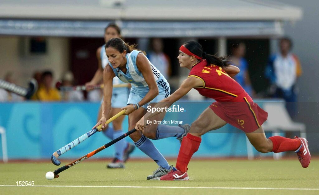 26 August 2004; Luciana Aymar, Argentina, in action against Zhou Wanfeng, China. Bronze Medal Match, Argentina v China, Olympic Hockey Centre, Helliniko Sports Complex. Games of the XXVIII Olympiad, Athens Summer Olympics Games 2004, Athens, Greece. Picture credit; Brendan Moran / SPORTSFILE