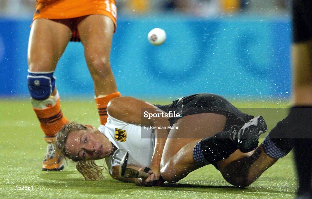 26 August 2004; Germany's Nadine Ernsting Krienke falls as she shoots against the Netherlands. Gold Medal Match, Netherlands v Germany, Olympic Hockey Centre, Helliniko Sports Complex. Games of the XXVIII Olympiad, Athens Summer Olympics Games 2004, Athens, Greece. Picture credit; Brendan Moran / SPORTSFILE