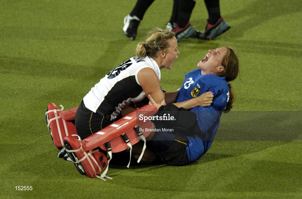 26 August 2004; Germany's Goalscorer Anke Kuehn, left, and substitute goalkeeper Julia Zwehl celebrate after victory over the Netherlands. Gold Medal Match, Netherlands v Germany, Olympic Hockey Centre, Helliniko Sports Complex. Games of the XXVIII Olympiad, Athens Summer Olympics Games 2004, Athens, Greece. Picture credit; Brendan Moran / SPORTSFILE