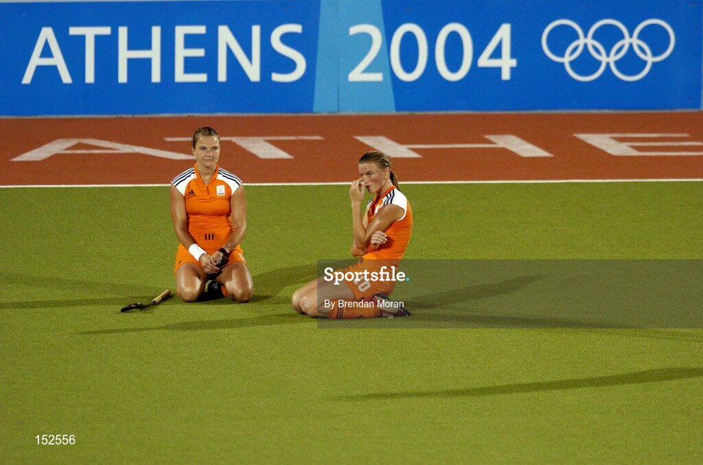 26 August 2004; Dejected Netherlands' players Ageeth Boomgaardt, left, and captain Mijntje Donners after defeat to Germany. Gold Medal Match, Netherlands v Germany, Olympic Hockey Centre, Helliniko Sports Complex. Games of the XXVIII Olympiad, Athens Summer Olympics Games 2004, Athens, Greece. Picture credit; Brendan Moran / SPORTSFILE