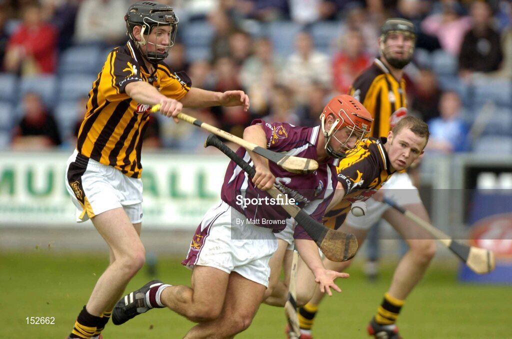 28 August 2004; Kenneth Burke, Galway, in action against Tommy Walsh, right, and Michael Fennelly, Kilkenny. Erin All-Ireland U21 Hurling Championship Semi-Final, Galway v Kilkenny, O'Moore Park, Portlaoise, Co. Laois.  Picture credit; Matt Browne / SPORTSFILE