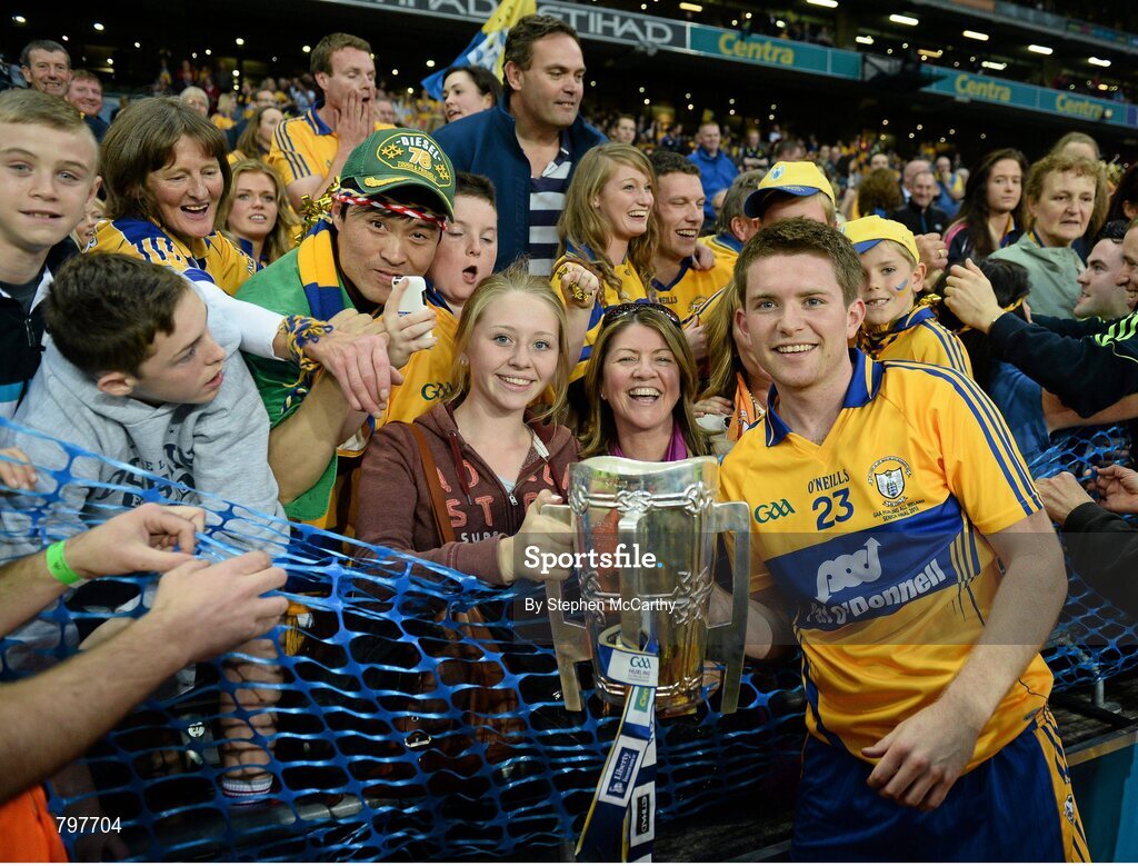 28 September 2013; Clare's Cathal Mc Inerney celebrates with supporters and the Liam MacCarthy cup after victory over Cork. GAA Hurling All-Ireland Senior Championship Final Replay, Cork v Clare, Croke Park, Dublin. Picture credit: Stephen McCarthy / SPORTSFILE
