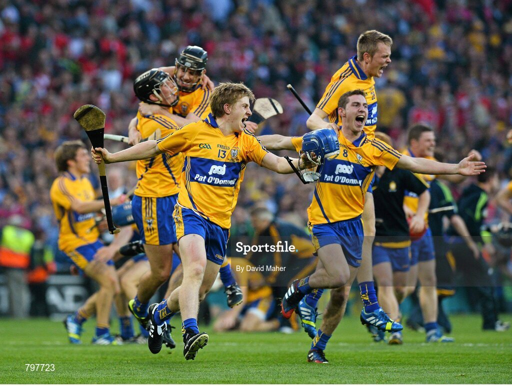 28 September 2013; Padraic Collins, 13, and Colm Galvin, 8, Clare celebrate with team-mates at the end of the game. GAA Hurling All-Ireland Senior Championship Final Replay, Cork v Clare, Croke Park, Dublin. Picture credit: David Maher / SPORTSFILE