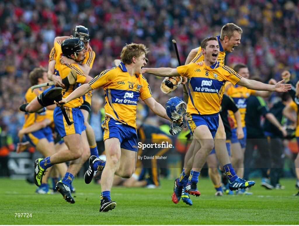28 September 2013; Padraic Collins, 13, and Colm Galvin, 8, Clare celebrate with team-mates at the end of the game. GAA Hurling All-Ireland Senior Championship Final Replay, Cork v Clare, Croke Park, Dublin. Picture credit: David Maher / SPORTSFILE