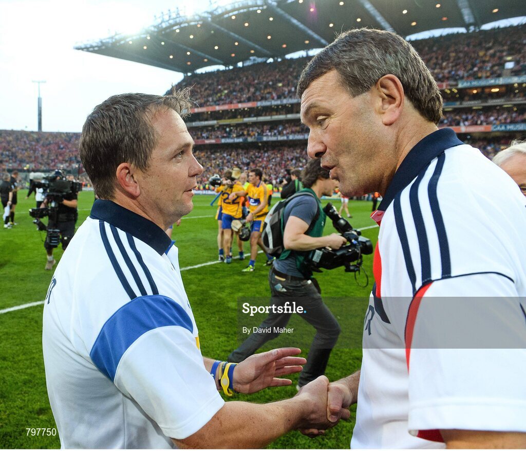 28 September 2013; Clare manager Davy Fitzgerald, left, is congratuladed by Cork manager Jimmy Barry Murphy at the end of the game. GAA Hurling All-Ireland Senior Championship Final Replay, Cork v Clare, Croke Park, Dublin. Picture credit: David Maher / SPORTSFILE
