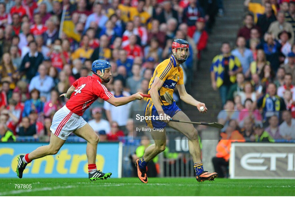 28 September 2013; Darach Honan, Clare breaks away from Conor O'Sullivan, Cork, on his way to scoring his sides fifth goal of the game. GAA Hurling All-Ireland Senior Championship Final Replay, Cork v Clare, Croke Park, Dublin. Picture credit: Barry Cregg / SPORTSFILE