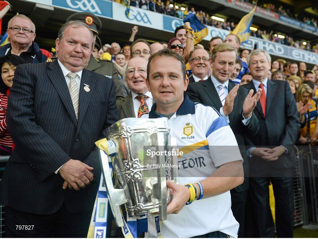 28 September 2013; Clare manager Davy Fitzgerald holds the Liam MacCarthy Cup in the company of the President of Ireland Michael D. Higgins, An Taoiseach Enda Kenny, Uachtarán Chumann Lúthchleas Gael Liam Ó Néill and  Ard Stiúrthoir of the GAA Páraic Duffy after the presentation. GAA Hurling All-Ireland Senior Championship Final Replay, Cork v Clare, Croke Park, Dublin. Picture credit: Ray McManus / SPORTSFILE