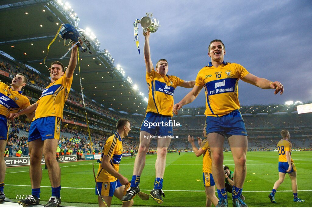 28 September 2013; Clare players, from left, Seadna Morey, Conor Ryan, Tony Kelly and John Conlon celebrate with the Liam MacCarthy Cup after the game. GAA Hurling All-Ireland Senior Championship Final Replay, Cork v Clare, Croke Park, Dublin. Picture credit: Brendan Moran / SPORTSFILE