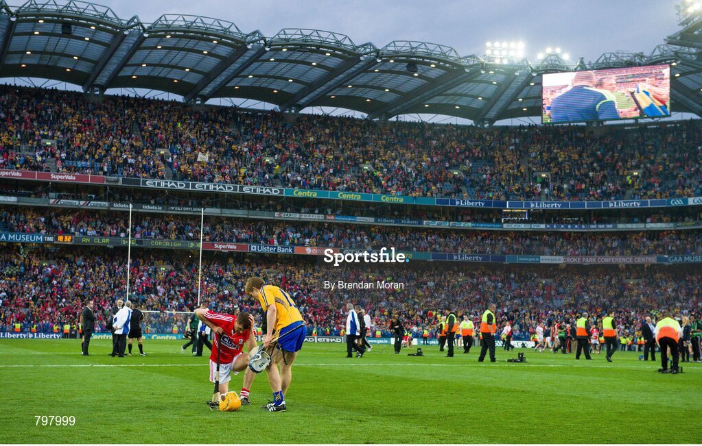 28 September 2013; Pádraic Collins, Clare, has a few words of consolation for Cathal Naughton, Cork, after the final whistle. GAA Hurling All-Ireland Senior Championship Final Replay, Cork v Clare, Croke Park, Dublin. Picture credit: Brendan Moran / SPORTSFILE
