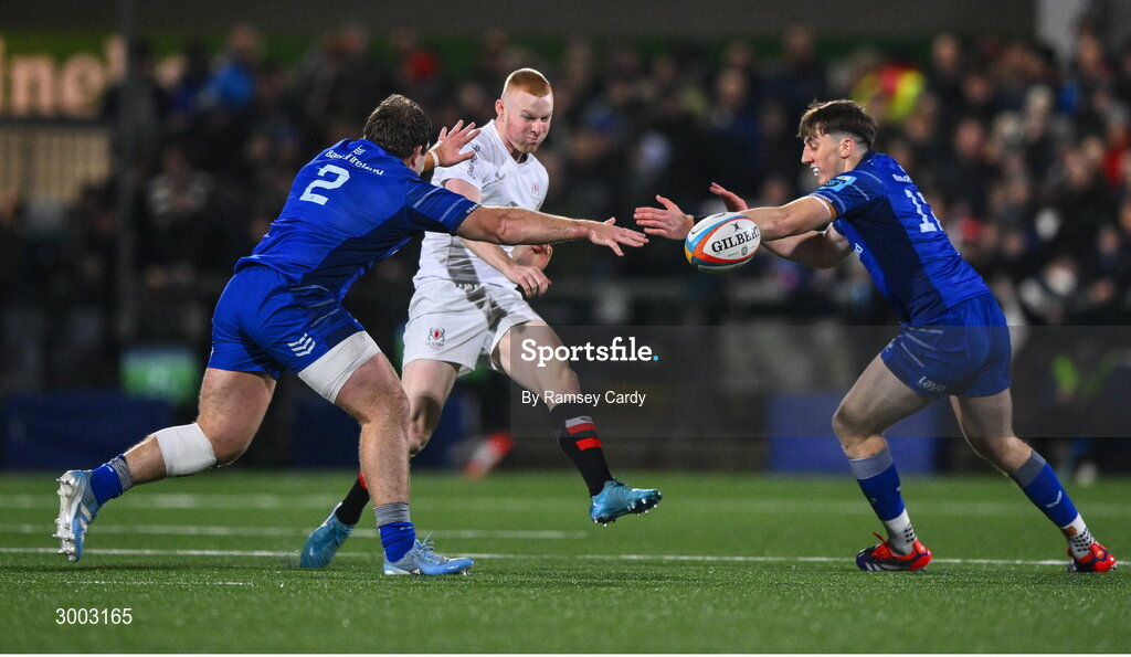 29 November 2024; Nathan Doak of Ulster in action against John McKee, left, and Charlie Tector of Leinster during the United Rugby Championship match between Ulster and Leinster at Kingspan Stadium in Belfast. Photo by Ramsey Cardy/Sportsfile