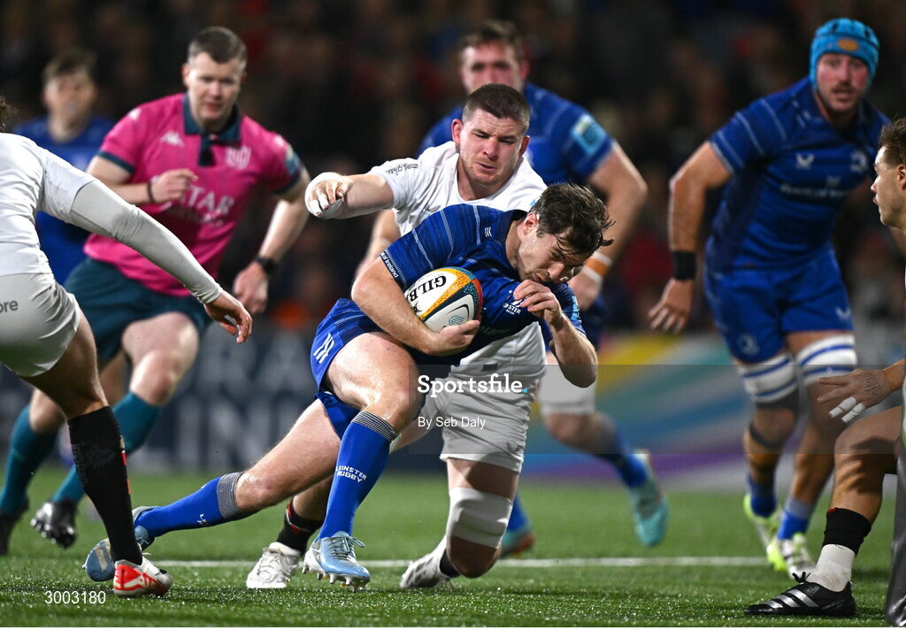 29 November 2024; Luke McGrath of Leinster evades the tackle of Ulster's Nick Timoney on his way to scoring his side's first try during the United Rugby Championship match between Ulster and Leinster at Kingspan Stadium in Belfast. Photo by Seb Daly/Sportsfile