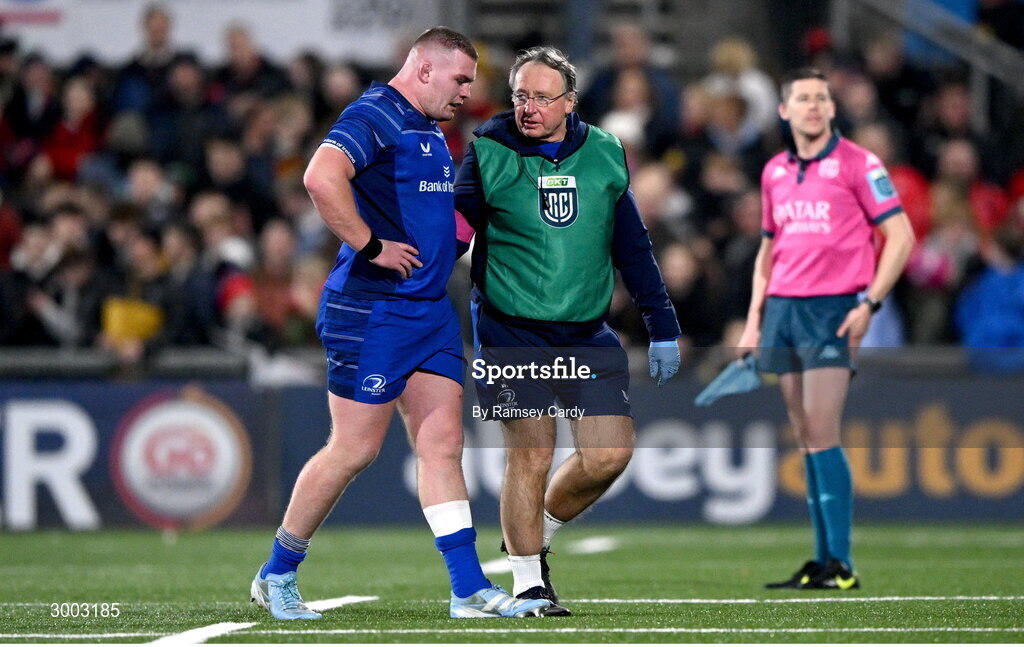 29 November 2024; Jack Boyle of Leinster leaves the pitch with Leinster head of medical Professor John Ryan during the United Rugby Championship match between Ulster and Leinster at Kingspan Stadium in Belfast. Photo by Ramsey Cardy/Sportsfile