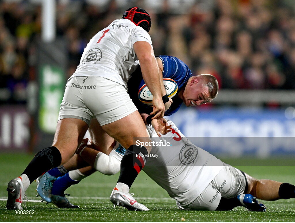 29 November 2024; Jack Boyle of Leinster is tackled by Ulster players Scott Wilson, right, and Eric O'Sullivan during the United Rugby Championship match between Ulster and Leinster at Kingspan Stadium in Belfast. Photo by Seb Daly/Sportsfile