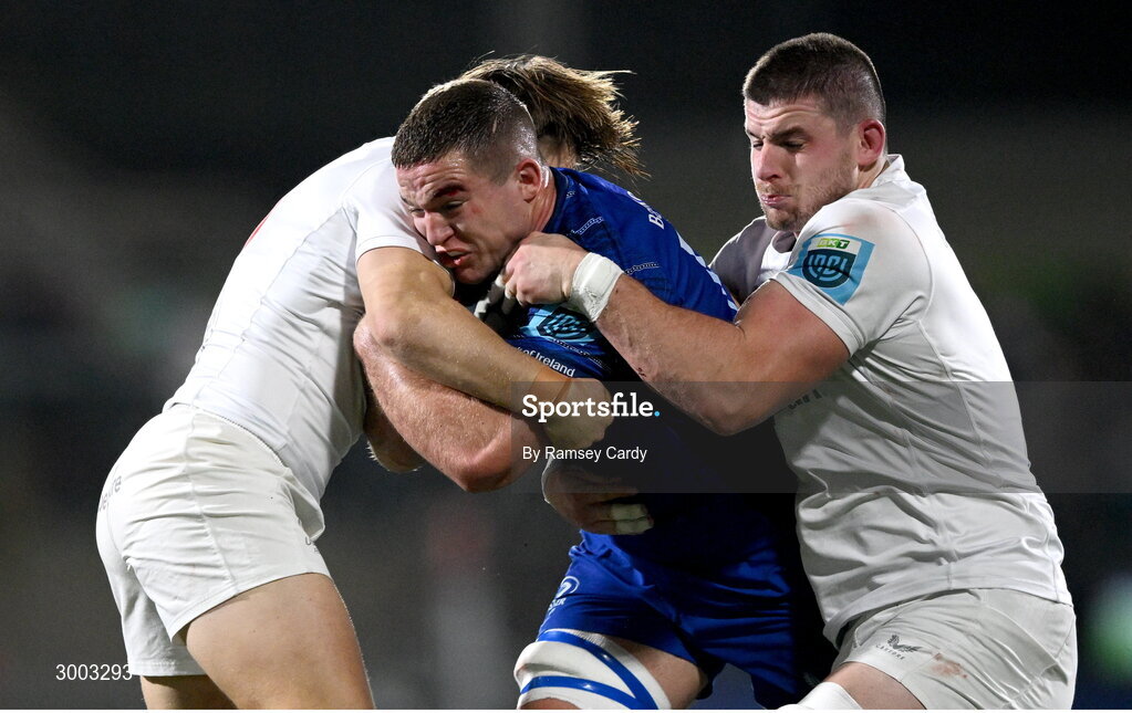 29 November 2024; Scott Penny of Leinster is tackled by Aidan Morgan, left, and Nick Timoney of Ulster during the United Rugby Championship match between Ulster and Leinster at Kingspan Stadium in Belfast. Photo by Ramsey Cardy/Sportsfile